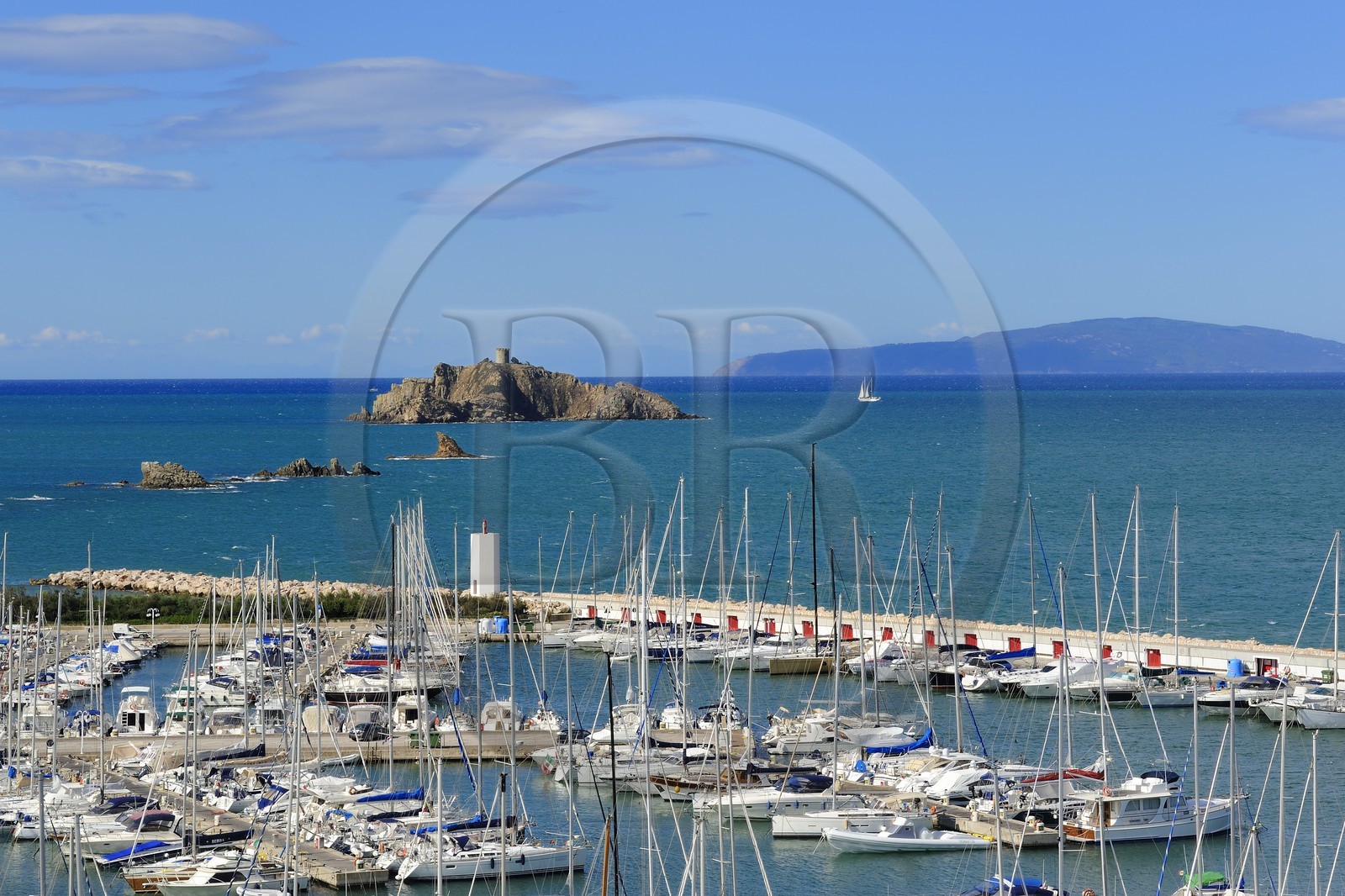 Italy, Tuscany, marina of Punta Ala and the Island of Elba in the background