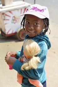 Zimbabwe, Harare, small black girl and her white doll