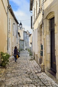 France, Charente, Cognac, medieval district of old Cognac, walking in rue Henri Germain