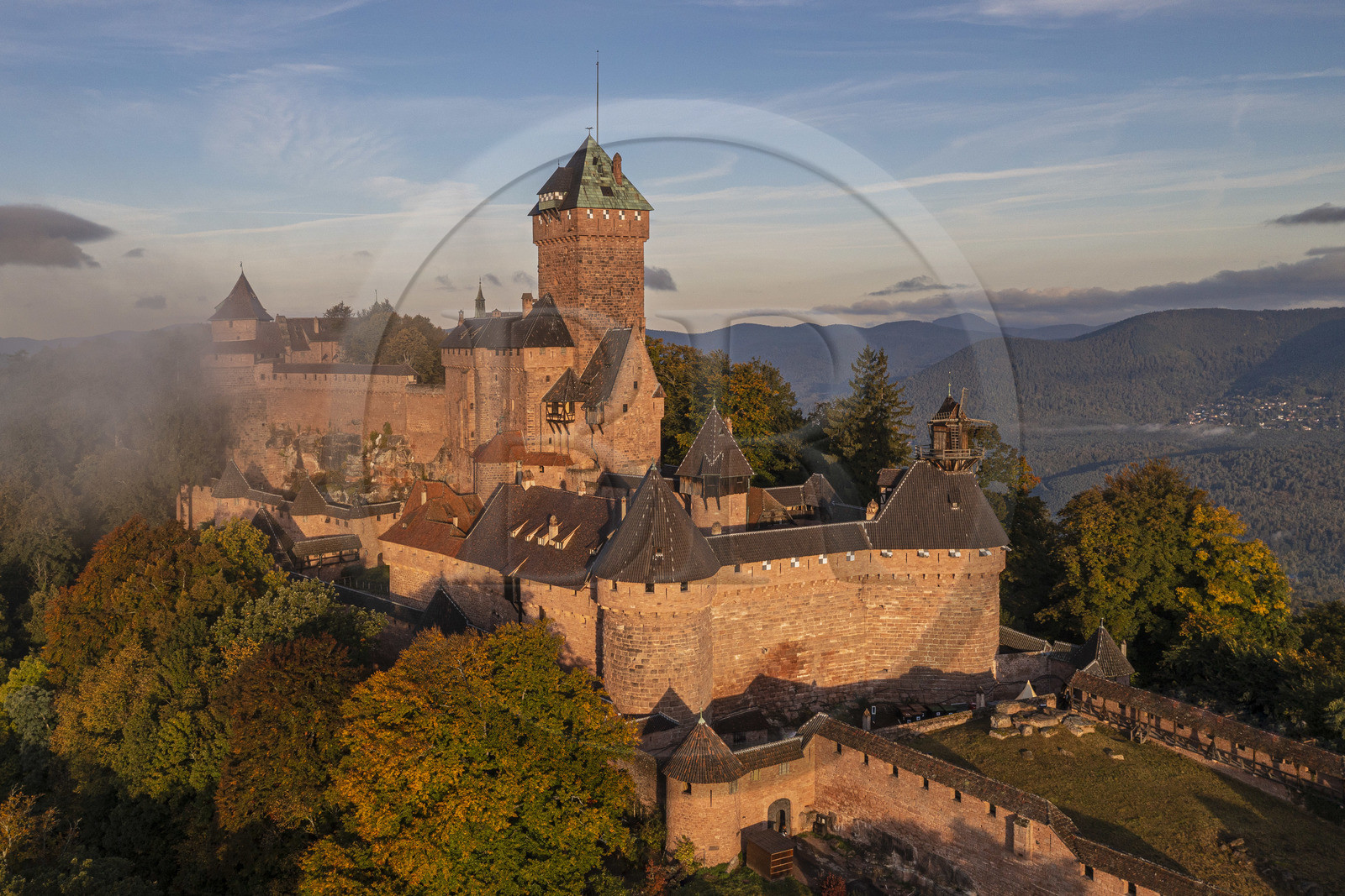 France, Bas Rhin, Orschwiller, Alsace Wine Road, the Haut Koenigsbourg Castle positioned on the Vosges foothills and overlooking the plain of Alsace to the east as well as the Villé and Bruche valleys to the west in the background (aerial view)