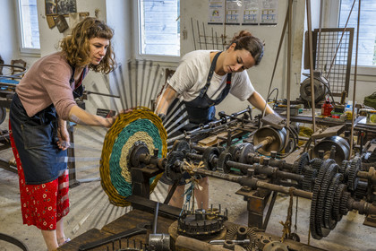 France, Drome, Drome provencale, Nyons, La Scourtinerie, the last scourtin factory in Provence, traditional filters used in the production of olive oil but also designed today as decorative objects made of coconut fiber, manufacturing of scourtins in their workshop on custom-made circular looms