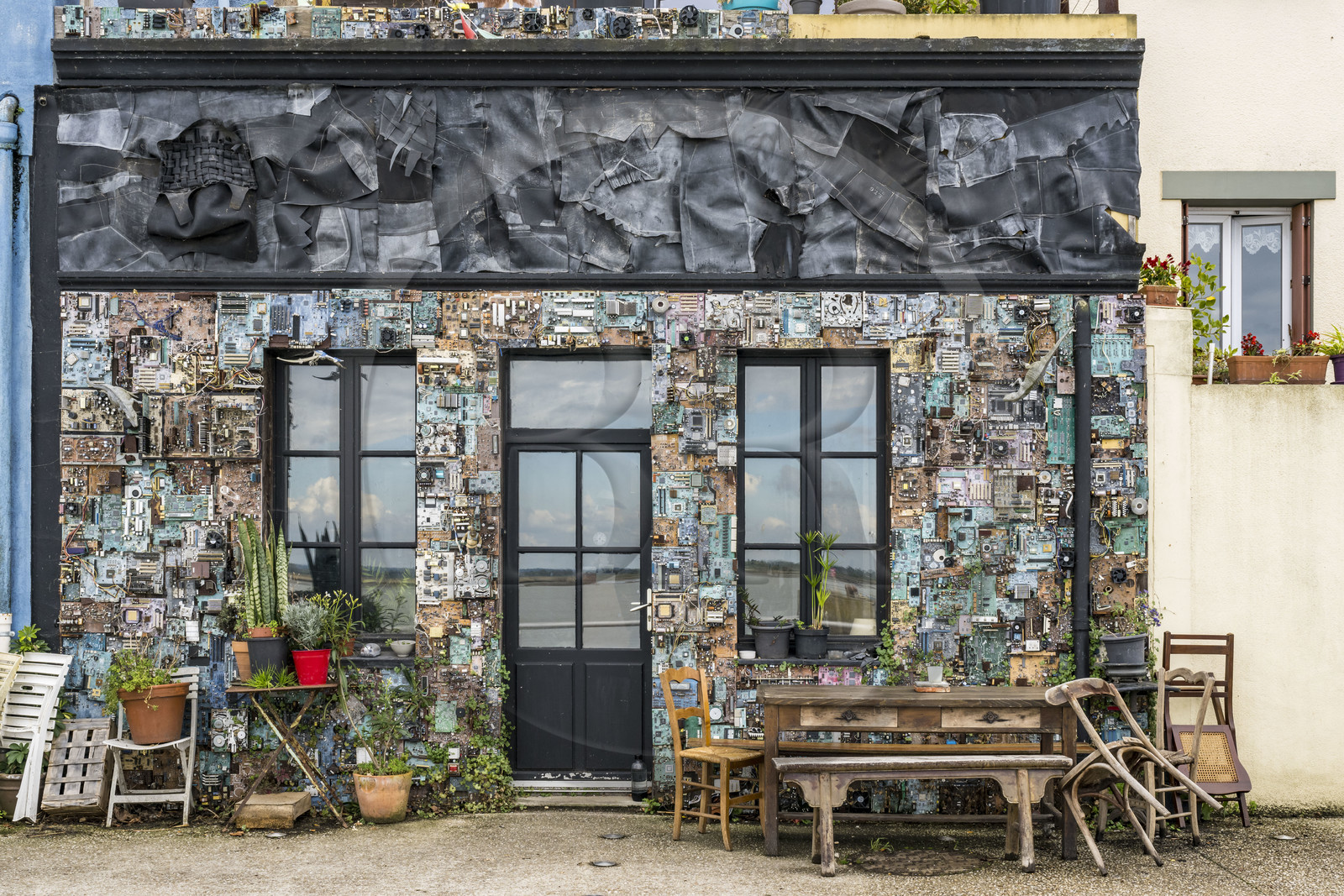 France, Loire Atlantique, Paimboeuf, the house of the artist Dominique Leroy decorated with thousands of electronic components, on the Sadi Carnot quay