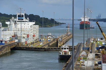 Panama, Colon province, Panama Canal, Gatun locks, Panamax container ship passing the lock, tugboat