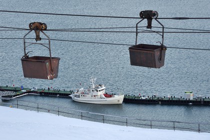 Norway, Svalbard, Spitzbergen, Longyearbyen Adventfjorden, old coal transport trolleys on the cableway over the port
