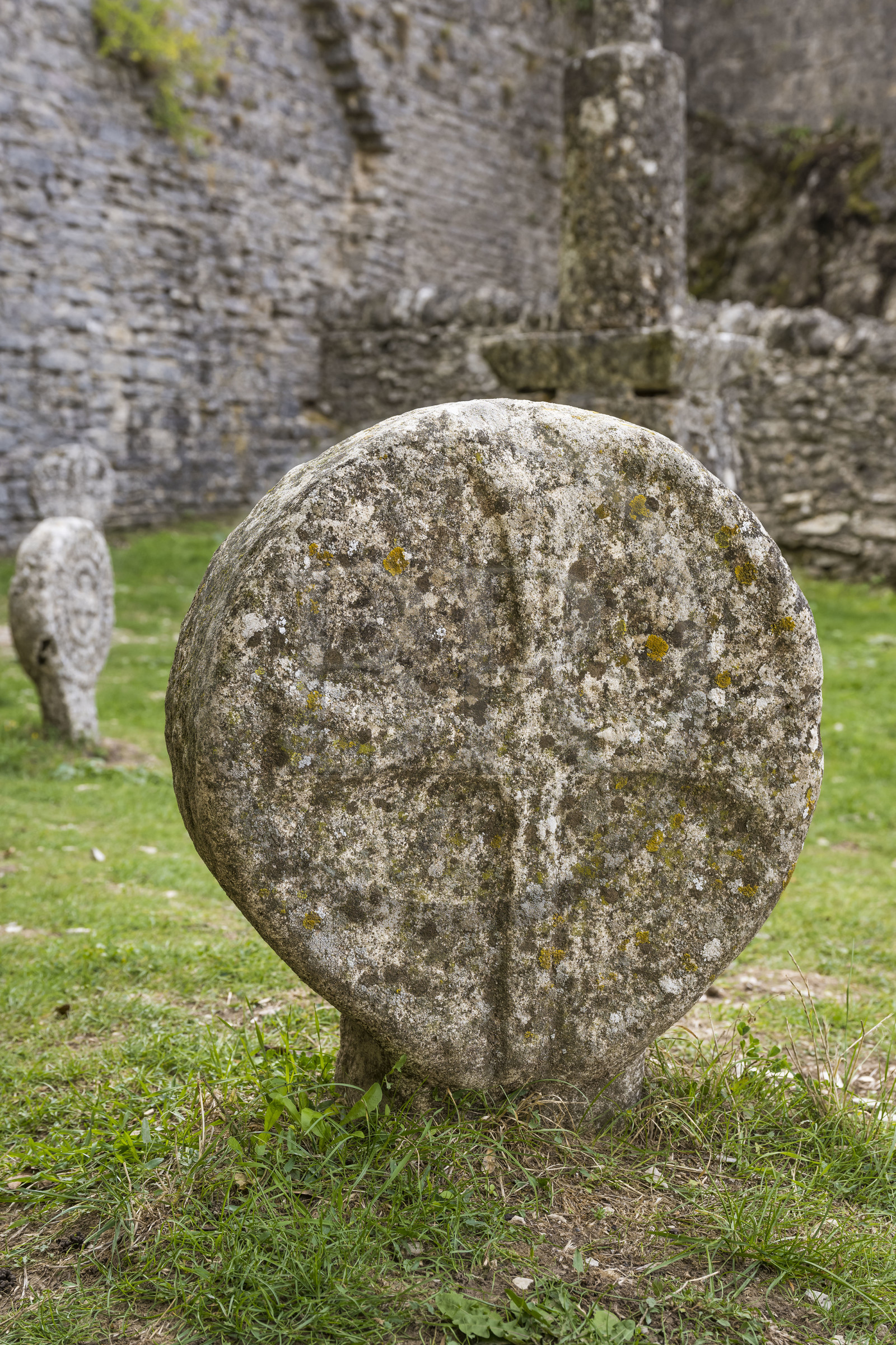 France, Aveyron, Causses and the Cévennes, cultural landscape of Mediterranean agro-pastoralism, listed as World Heritage by UNESCO, La Couvertoirade, labelled Les Plus Beaux Villages de France (The Most Beautiful Villages of France), fortified village on the Larzac plateau, discoidal tombstone, replica of a medieval cross stele discovered on the Larzac, in the cemetery in front of Saint-Christol church