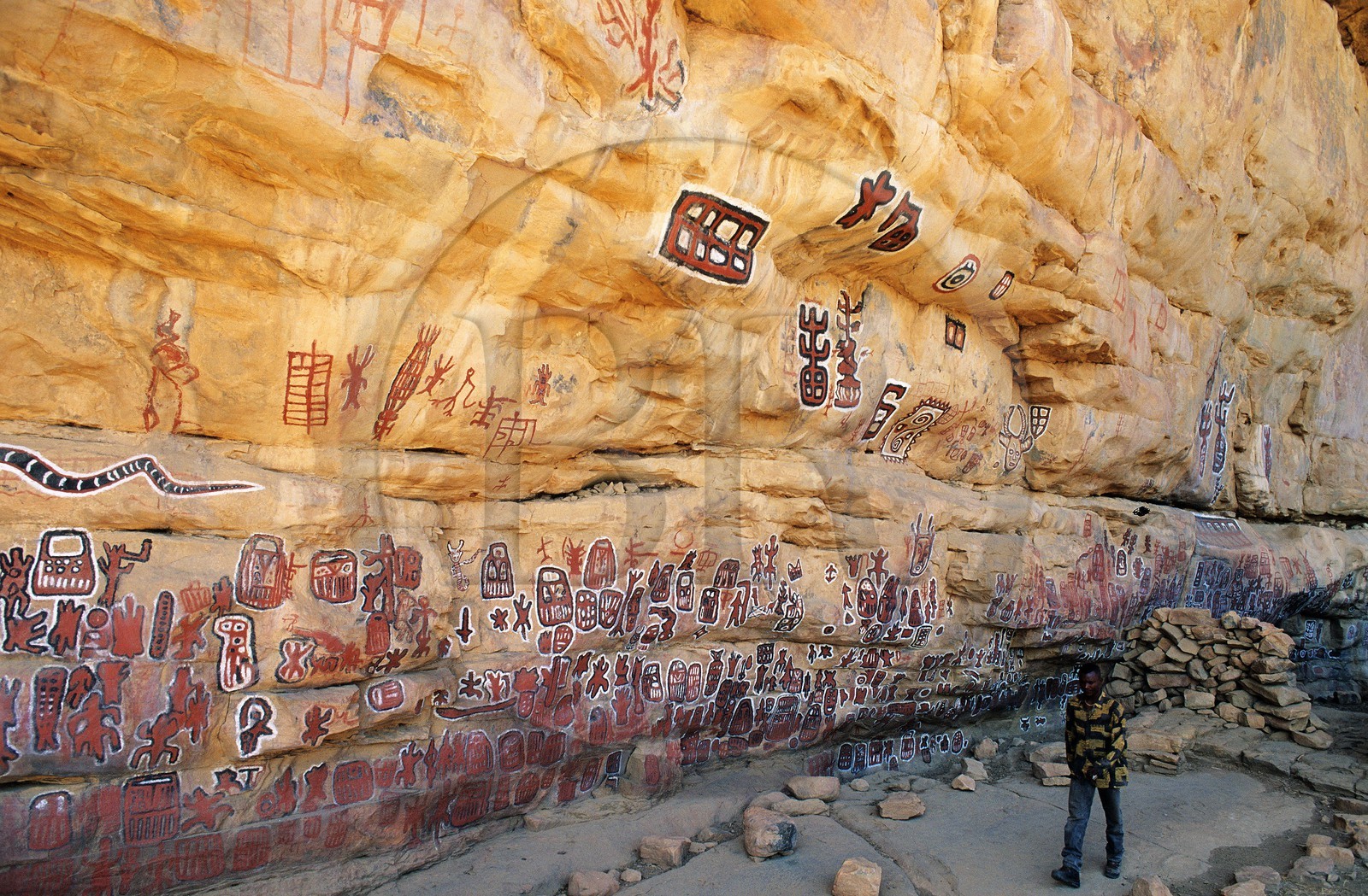 Mali, Dogon Country, Bandiagara Cliff listed as World Heritage by UNESCO, sloping rock in the village of Songo where circumcised young boy draw their mark. cave paintings