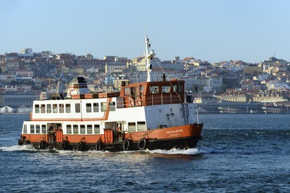 Portugal, Lisbon, ferry on the Tagus river (rio Tejo) and the historical center in the background