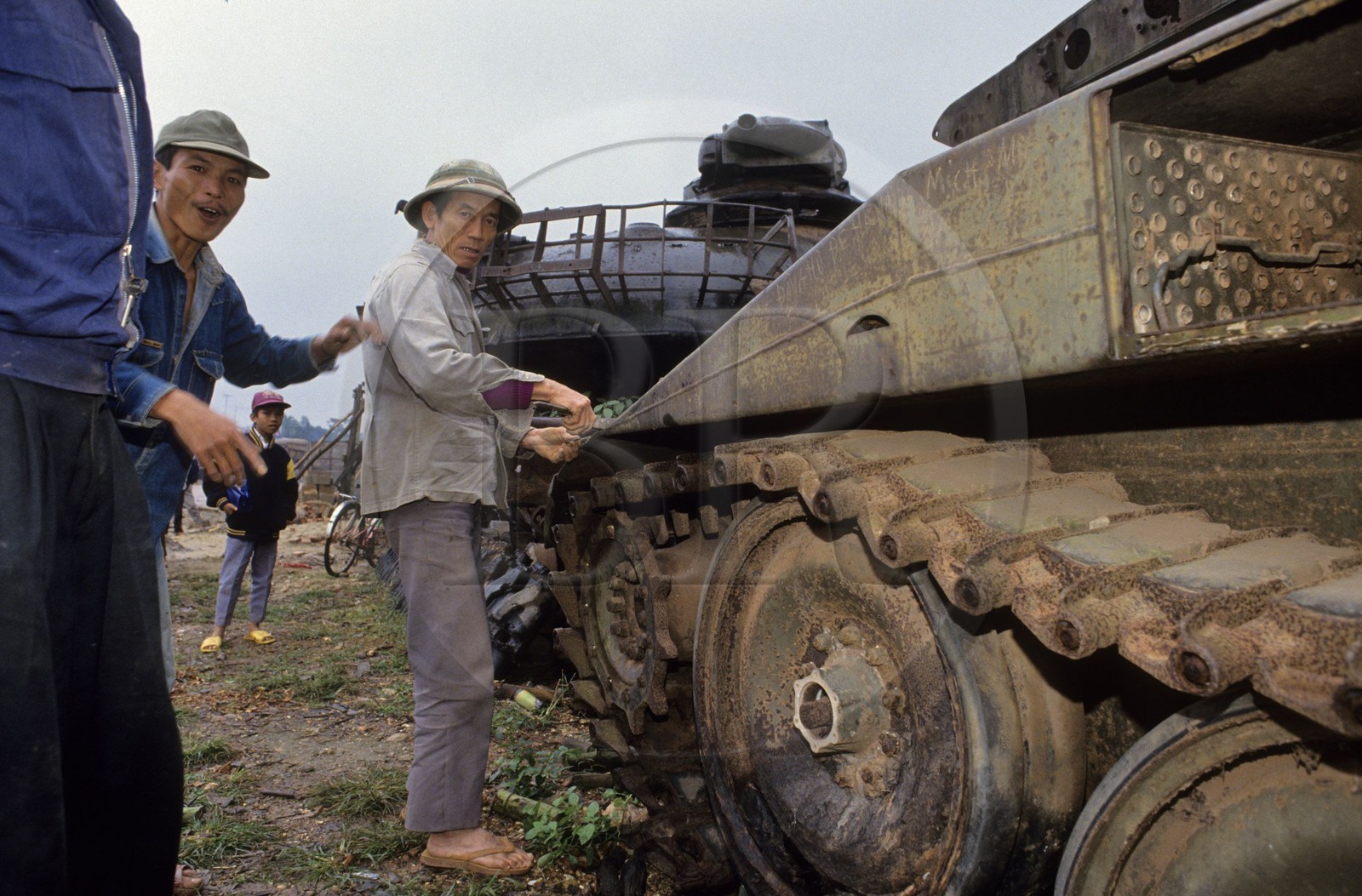 Vietnam, metal recovery on abandoned American tanks on the border of Laos