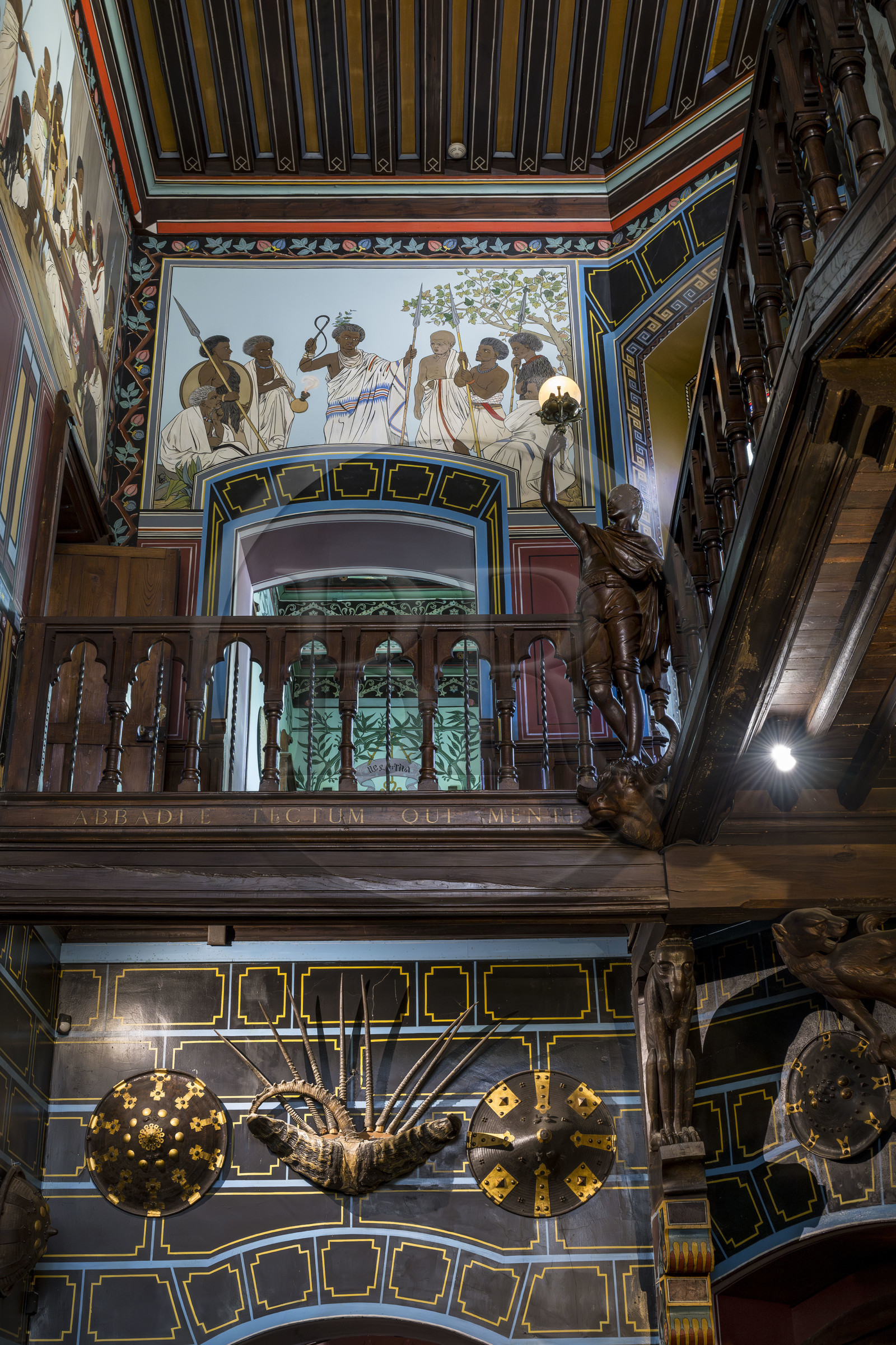 France, Pyrenees Atlantiques, Basque Country coast, Hendaye, Abbadia castle built in 1870 by Eugène Viollet-le-Duc for Antoine d'Abbadie d'Arrast, the Ethiopian paintings of the vestibule and the grand staircase, torchiere lamp statue representing Abdullah former Ethiopian slave freed and dead under the commune of Paris