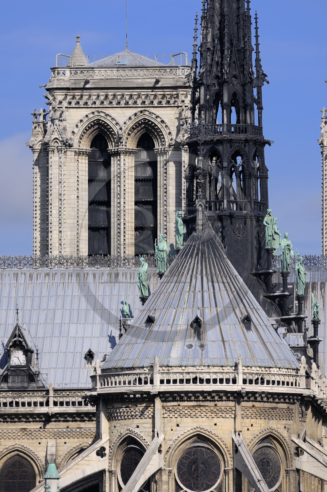 France, Paris, ile de la Cite, Notre-Dame Cathedral, the spire dominates the statues of green copper of twelve apostles with the symbols of four evangelists