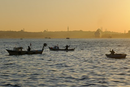 Turkey, Istanbul, fishermen boats on the Bosphorus Strait, the Golden Horn Strait in the background