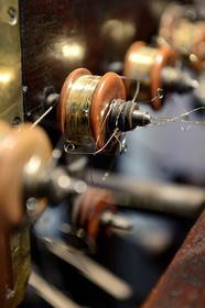 France, Rhone, Lyon, La Croix Rousse District, la Maison des Canuts, machine that allows gold blades to surround the silk yarn