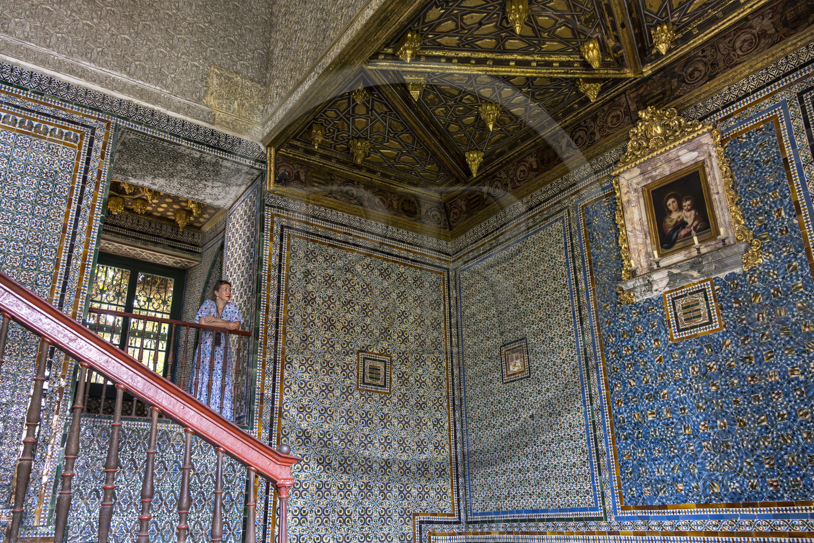 Spain, Andalusia, Sevilla, Casa de Pilatos (Pilate's House), a Mudejar-style palace, the stairwell is decorated with rich 16th century azulejos and topped with a marquetry ceiling.