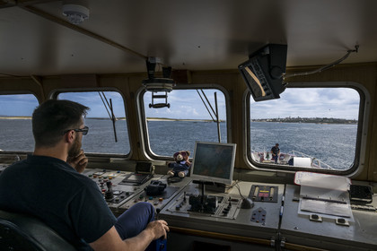 France, Finistère, Iroise Sea, Molene Island, Penn ar Bed boat connecting with the islands of Molene and Ouessant, arrival on the Island of Molène seen from the bridge with the pilot