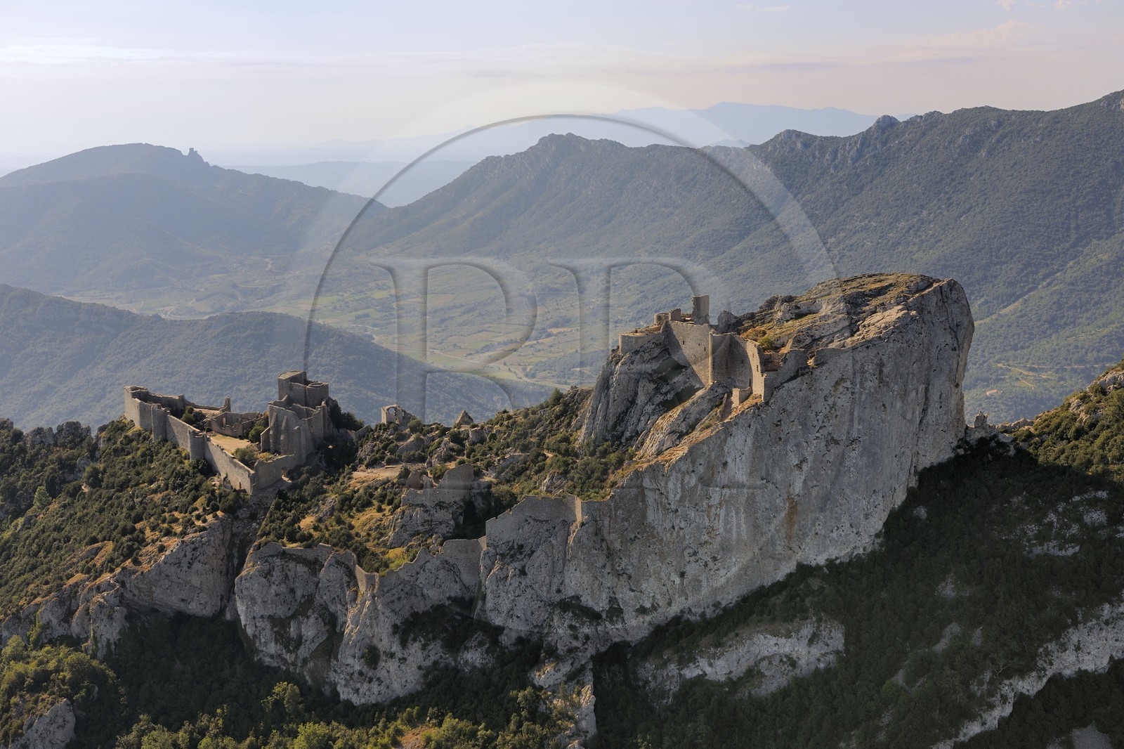 France, Aude, Peyrepertuse, the ruins of Cathar castle built in XIIth century and the castle of Queribus in shape in the background (aerial view)