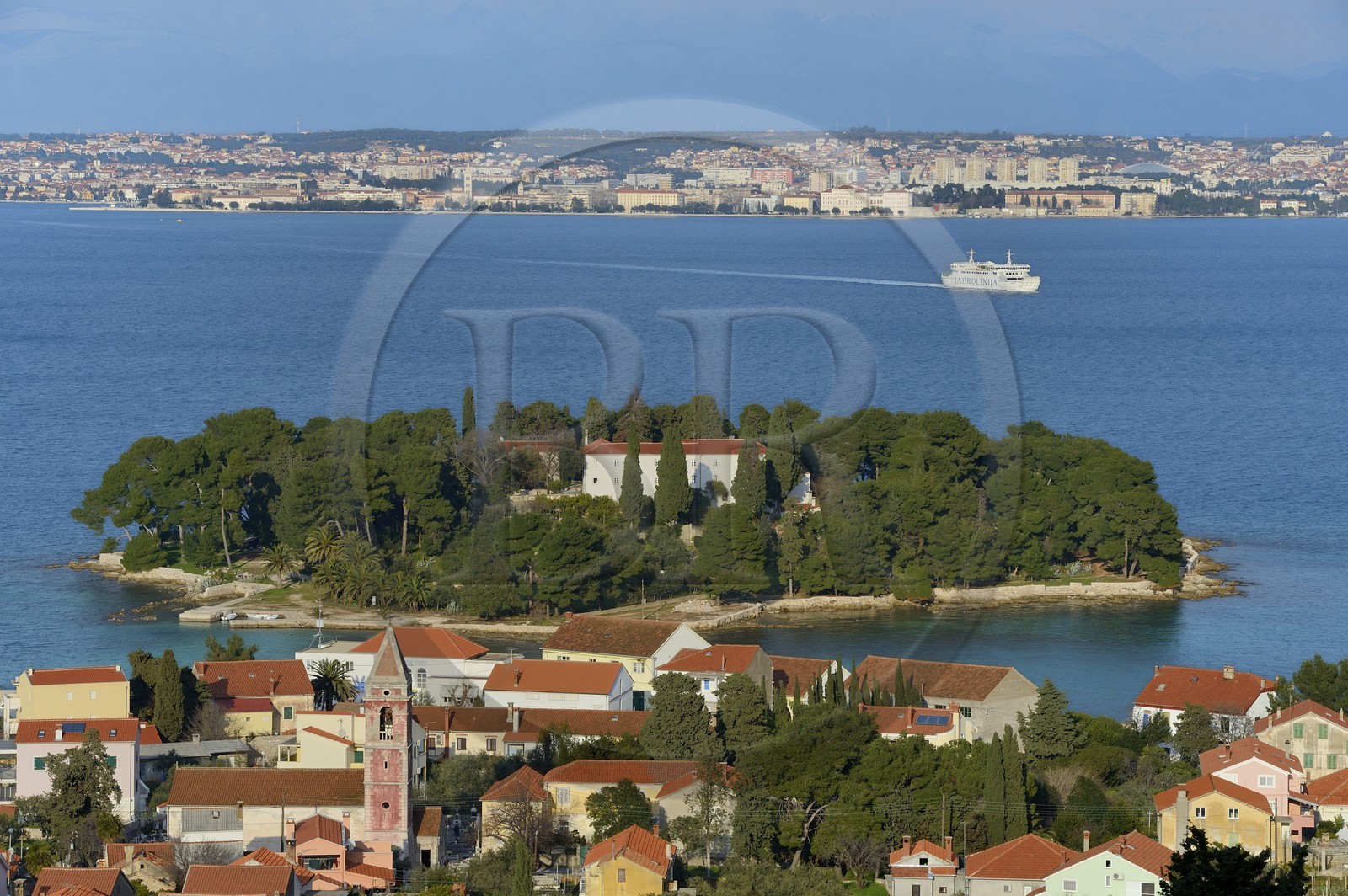 Croatia, Dalmatia, Dalmatian Coast, Ugljan Island, Preko, Franciscan Monastery on the Galovac island, Zadar in the background
