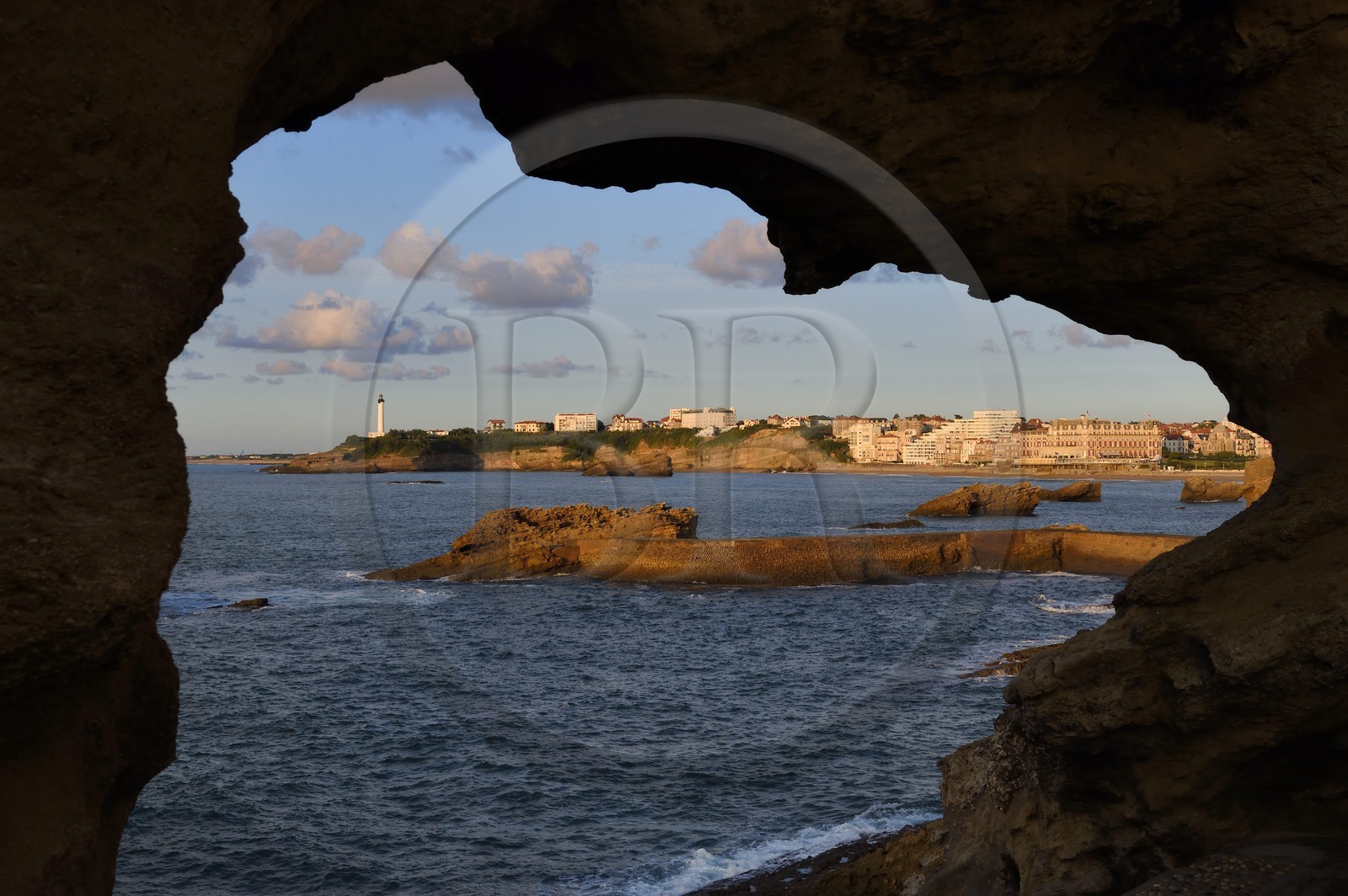 France, Pyrenees Atlantiques, Basque Country, Biarritz seen from the Rocher de la Vierge, the lighthouse and the Hotel du Palais located on Grande Plage (Great beach) in the background