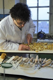 France, Yvelines, Chateau de Versailles, the castle restoration workshop, gilt workshop, Laurent Hissier working on a frame