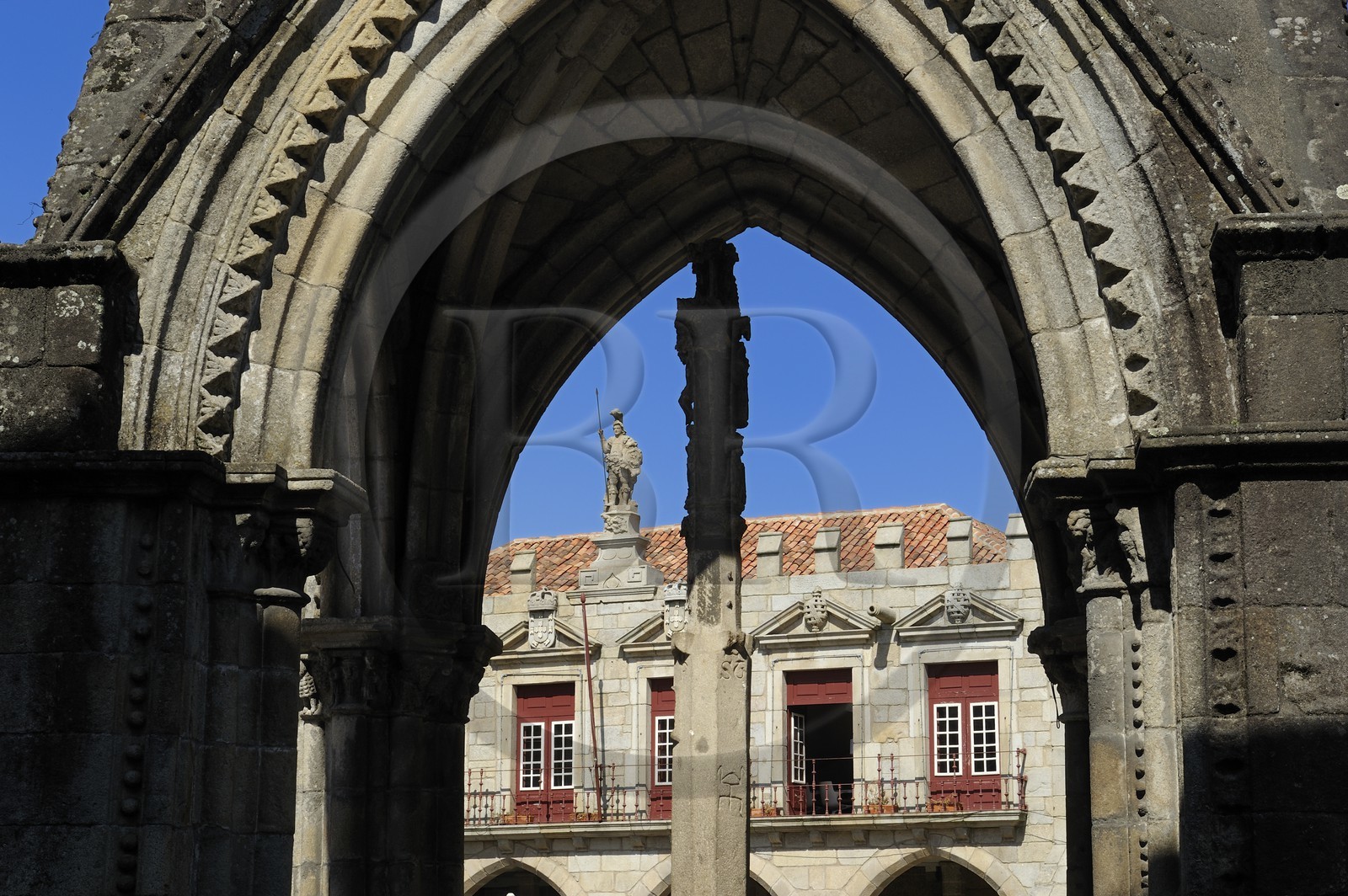 Portugal, Minho region, Guimaraes, town listed as World Heritage by UNESCO, gothic belvedere in front of the Church of Nossa Senhora da Oliveira on Largo da Oliveira square