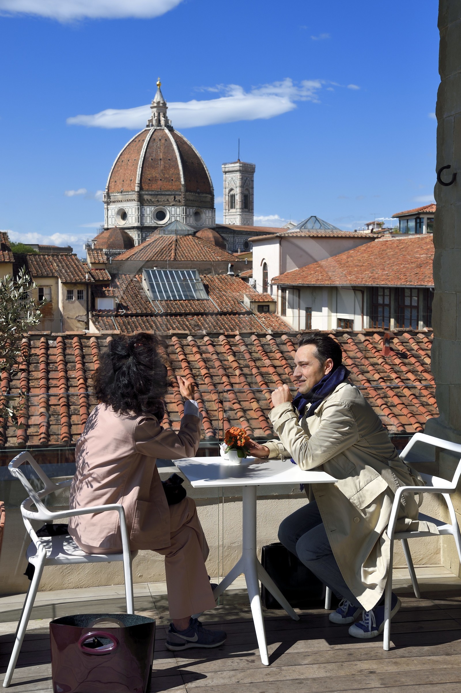 Italy, Tuscany, Florence, listed as World Heritage by UNESCO, the Duomo Santa Maria del Fiore seen from the Hospital of the Innocent café (Spedale degli Innocenti)