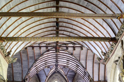 France, Finistere, Pleyben church, wooden painted sculptures on the stringer decorating the vault