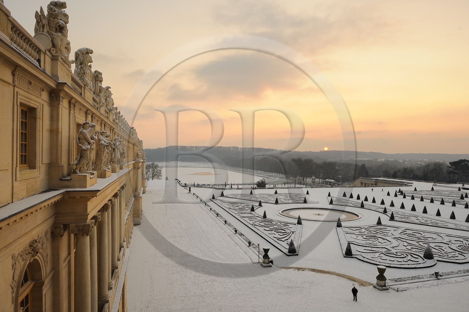 France, Yvelines, snow covered park of the Chateau de Versailles, listed as World Heritage by UNESCO, Midi bed at sunset