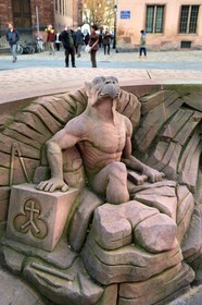 France, Bas Rhin, Strasbourg, old town listed as World Heritage by UNESCO, place du Chateau, chimera extracting from the stone with the look pointed towards the top of the Cathedral