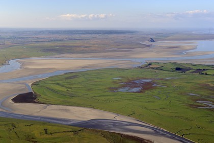 France, Manche, Bay of Mont Saint Michel, listed as World Heritage by UNESCO, Mont Saint Michel at low tide, the Sée and Selune river in the foreground (aerial view)