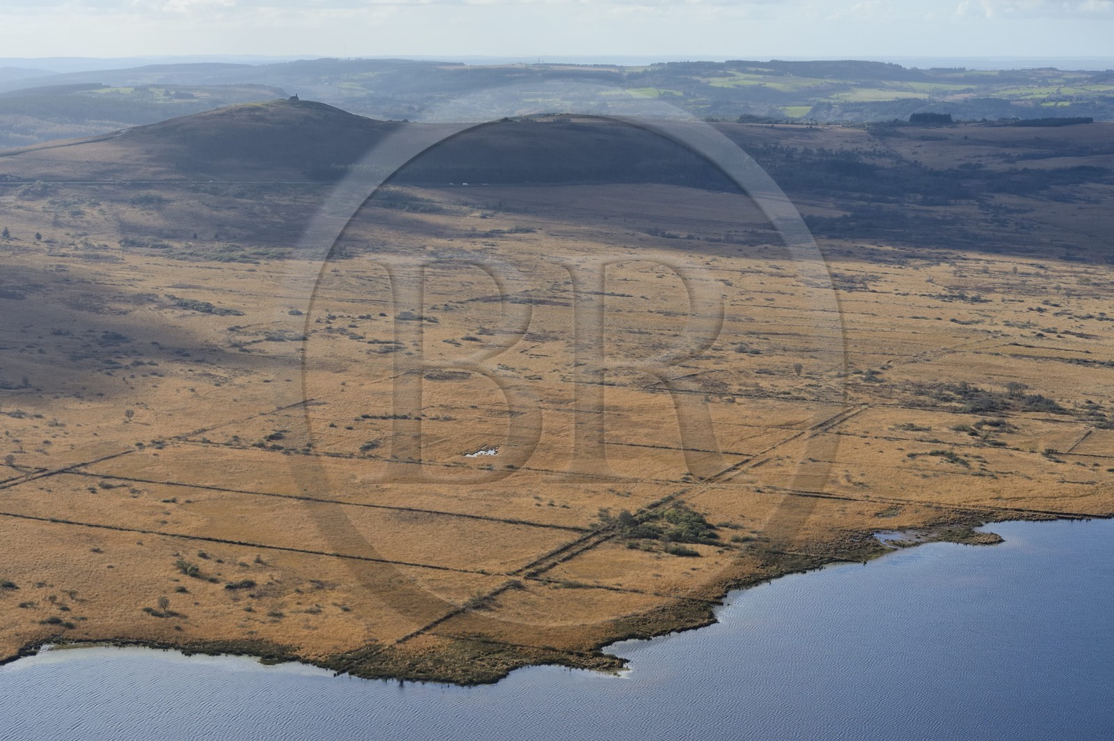 France, Finistere, Parc Naturel Regional d'Armorique (Armorica Regional Natural Park), Monts d'Arree, Brasparts, the Saint-Michel reservoir and  the Saint Michel chapel at the top of Menez Mikael in the background (aerial view)