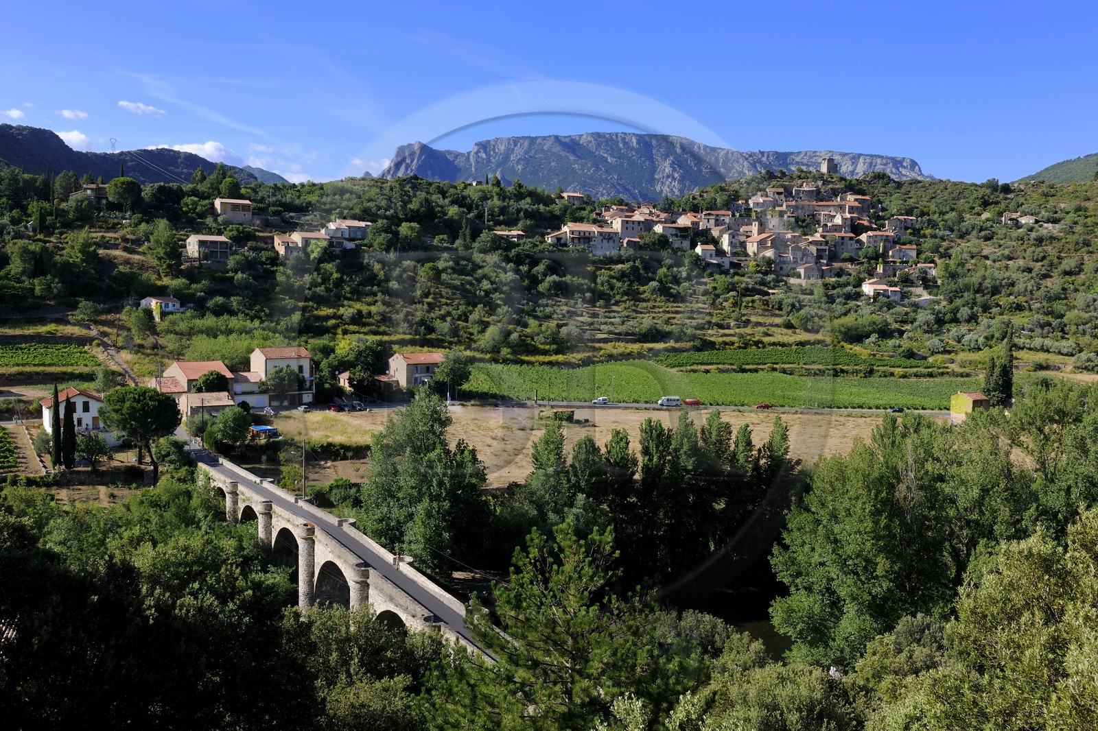 France, Herault, Orb river valley, village of Vieussan in the distance and AOC Saint-Chinian & Roquebrun