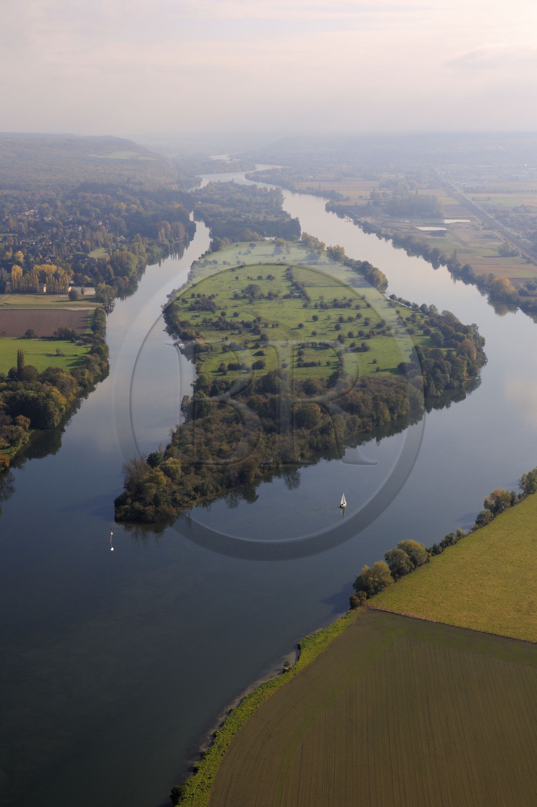 France, Eure, the Seine downstream of Vernon around Notre-Dame de l'Isle, a small boat sailing in front of the island Emient (aerial view)