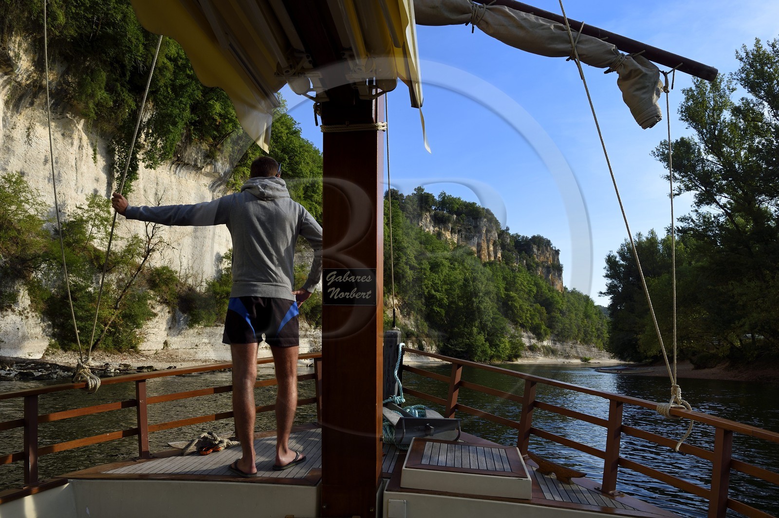 France, Dordogne, Perigord Noir, Dordogne Valley, gabare (flat-bottomed boat) on the Dordogne river upstream La Roque Gageac, labelled Les Plus Beaux Villages de France (The Most Beautiful Villages of France)