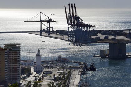 Spain, Andalusia, Malaga, the harbour cranes and the lighthouse
