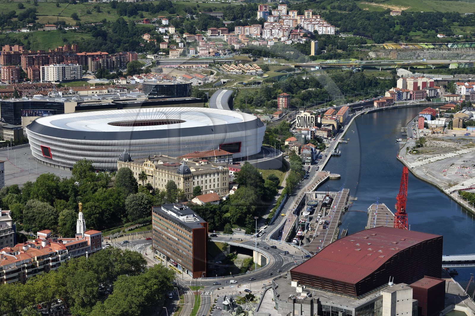 Spain, Basque Country, Biscay Province, Bilbao, the San Mamés Stadium (2013) by architect Norman Foster and the Euskalduna Palace (Palace of Congresses and Music) right next to the Ria de Bilbao