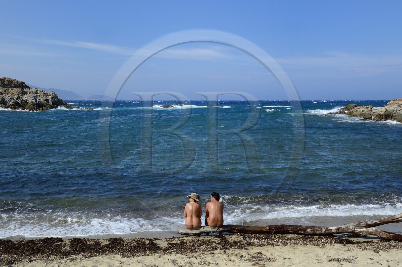 France, Haute Corse, Nebbio, Agriates Desert, Peraiola Cove, Nudist couple on a small beach in the East of Ostriconi beach