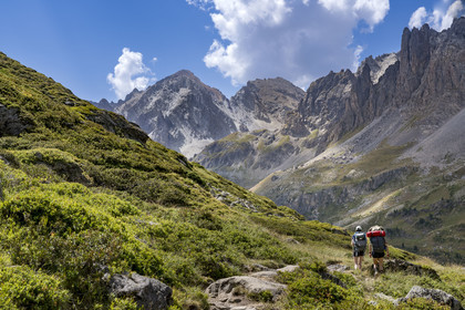 France, Hautes Alpes, Briancon region, Nevache, the upper Clarée valley, hikers in the upper Clarée valley, the Cerces massif in the background
