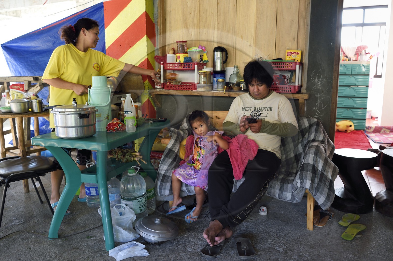 Philippines, Ifugao province, Banaue town, inside the habitat of a family housed in a building under construction