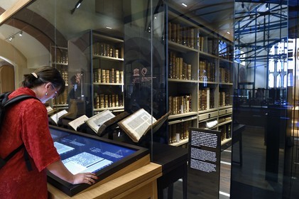 France, Bas Rhin, Selestat, the Humanist Library refitted by architect Rudy Ricciotti, digital reading of the books on the back of the screens, the personal library of Beatus Rhenanus (1485-1547) is in the background in the glass room