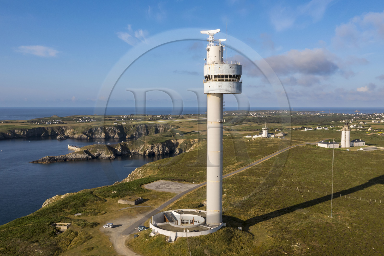 France, Finistère, Iroise Sea, Ouessant Island, Stiff radar tower by architect Jean Prouvé (1982) which monitors the maritime traffic rail in the Channel for the Cross Corsen, the bay, the semaphore and the Stiff lighthouse in the background (aerial view)