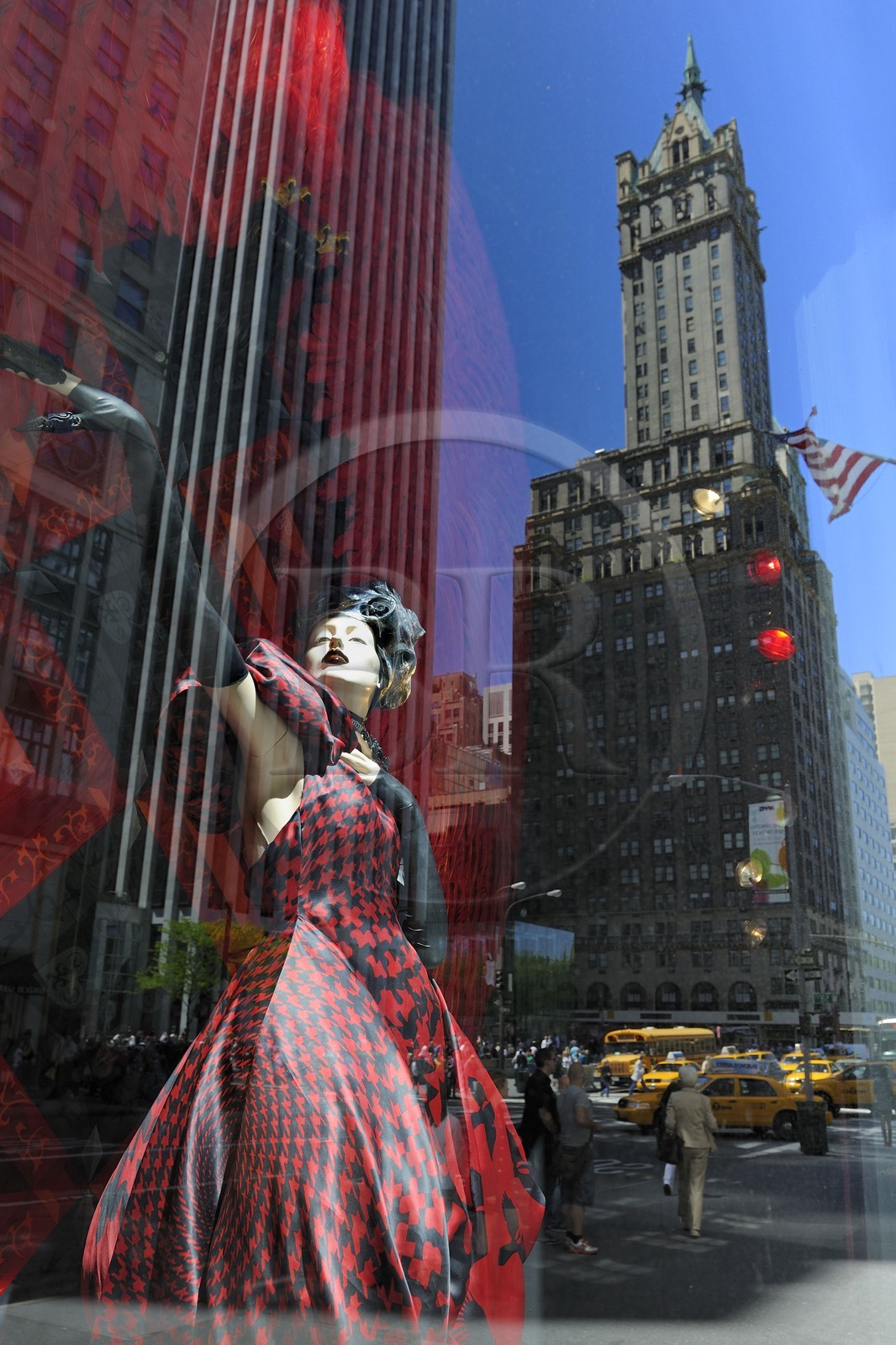 United States, New York, Manhattan, reflection of a skyscraper in a shop window dedicated to Alexander McQueen of the store Bergdorf Goodman on 5th Avenue